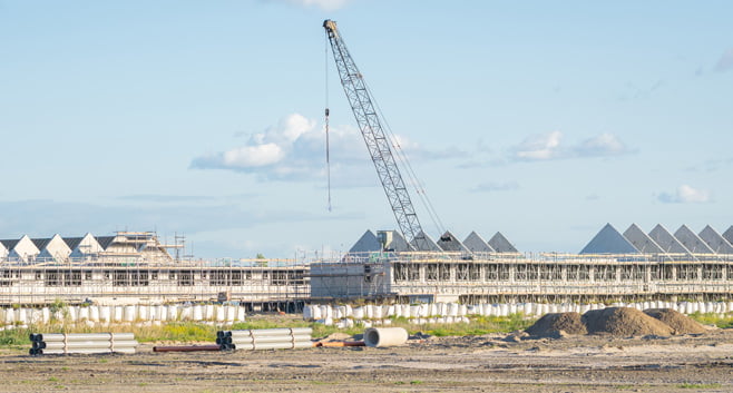 Bezuinigingen bij gemeenten leiden tot rem op bouw nieuwe woningen